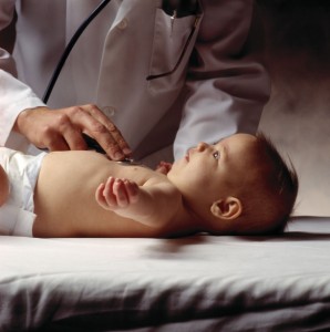 doctor checking baby's heart