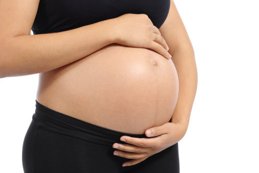 woman holding pregnant belly