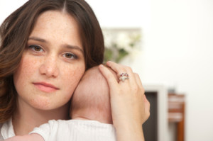 mother holding baby