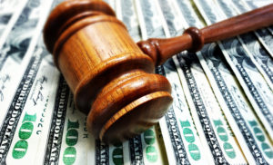 court gavel and settlement money