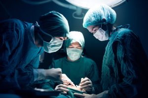 Surgical team working on a patient in operating theater